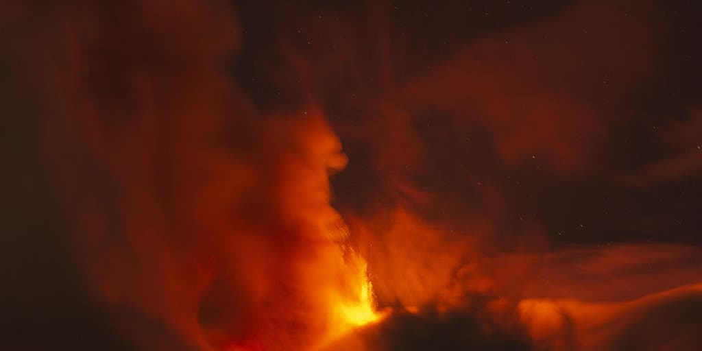 Italy’s Mount Etna volcano spews lava fountain into the sky above Sicily Italy’s Mount Etna volcano spews lava fountain into the sky above Sicily