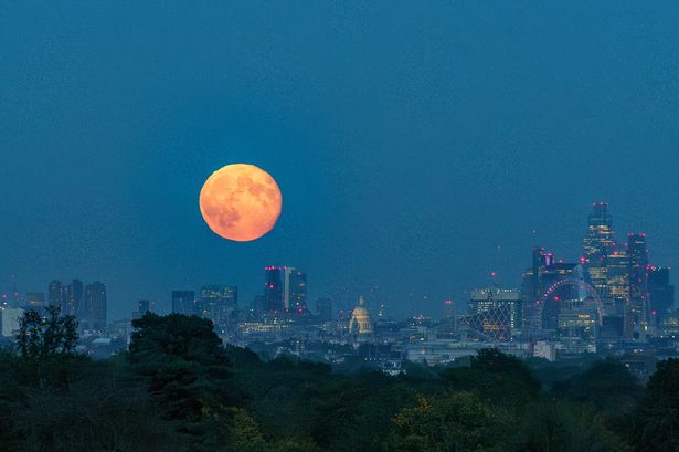 Beautiful photos show bright orange Hunter’s supermoon over London skyline