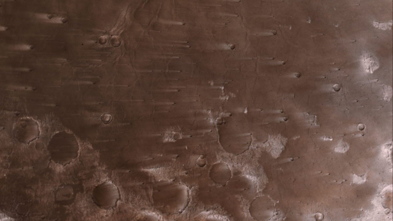 NASA’s Psyche Mission Spies Mars’ Wind-Blown Craters During Close Approach